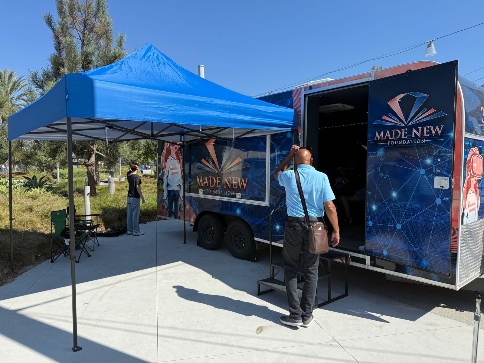 The Made New Foundation mobile trailer open to visitors.